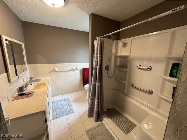 bathroom featuring tile walls, tile patterned flooring, a textured ceiling, and a shower with shower curtain