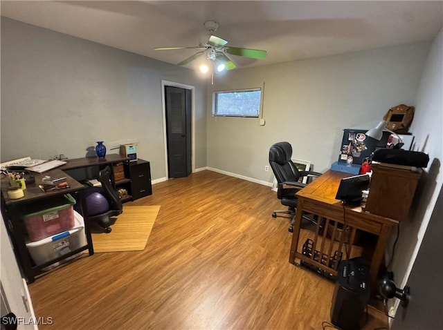 office area with hardwood / wood-style flooring and ceiling fan