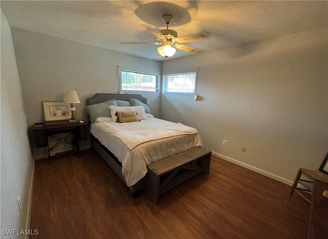 bedroom featuring dark hardwood / wood-style floors and ceiling fan