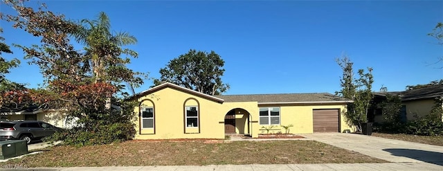 ranch-style house featuring a garage