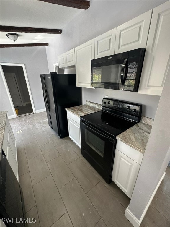 kitchen with black appliances, white cabinetry, light stone counters, and beam ceiling