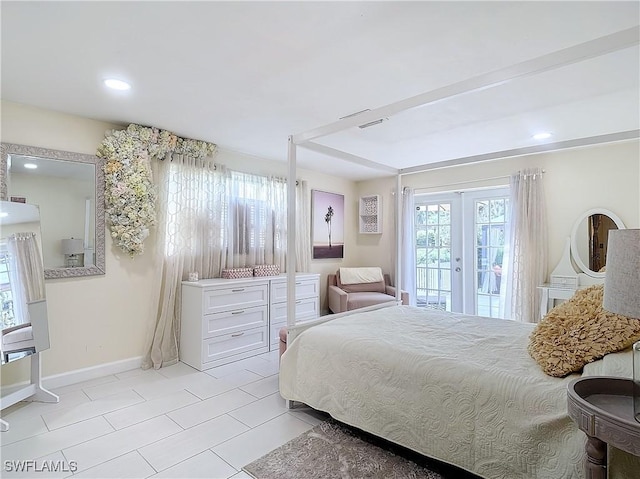 bedroom featuring access to exterior, french doors, and light tile patterned flooring