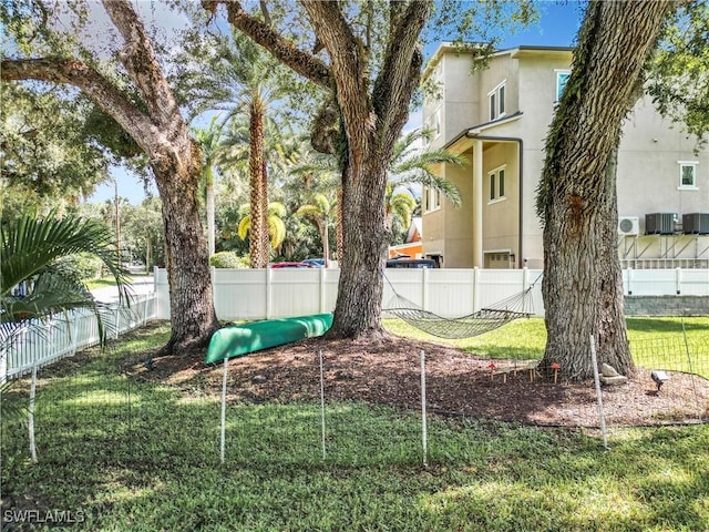 view of yard featuring a playground and central air condition unit