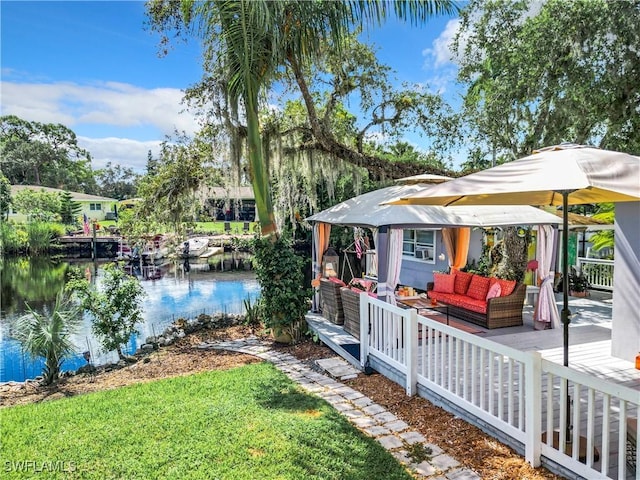 exterior space with a gazebo, an outdoor living space, and a water view