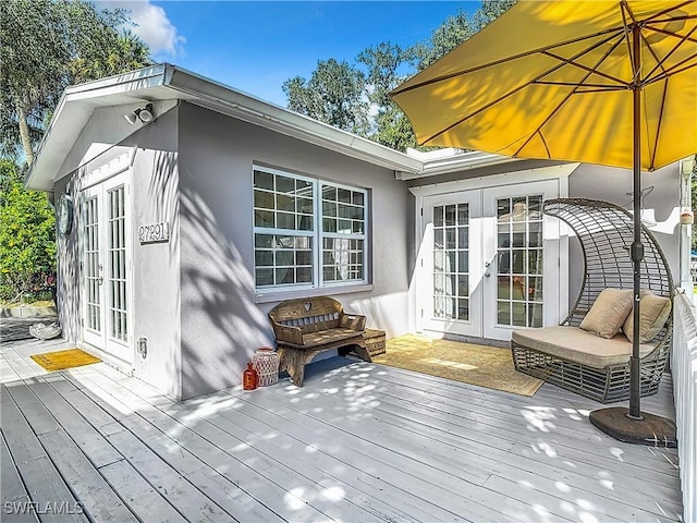 wooden deck featuring french doors