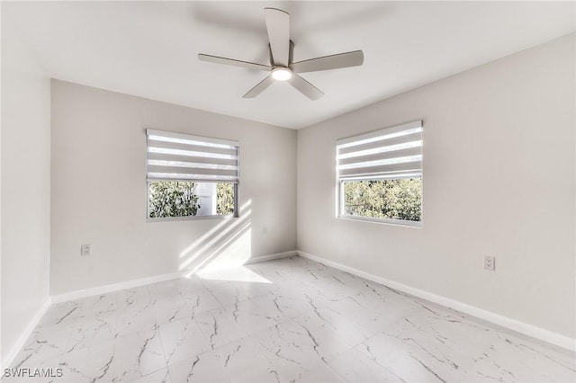 spare room with ceiling fan