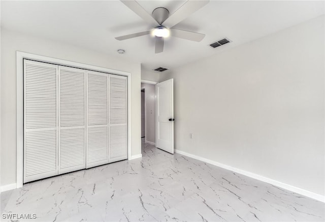 unfurnished bedroom with a closet and ceiling fan