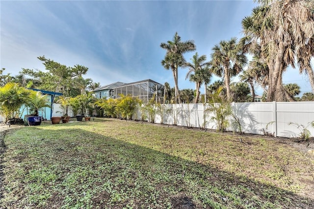 view of yard with a lanai