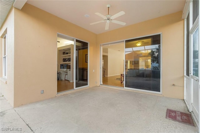 exterior space featuring ceiling fan