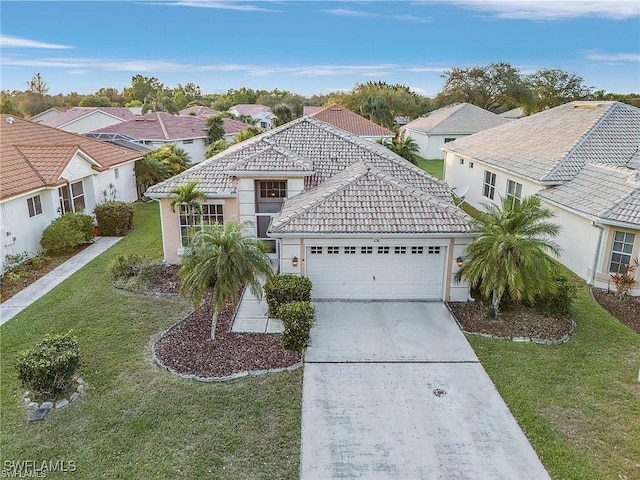 view of front of home with concrete driveway, a residential view, a front lawn, a garage, and a tiled roof