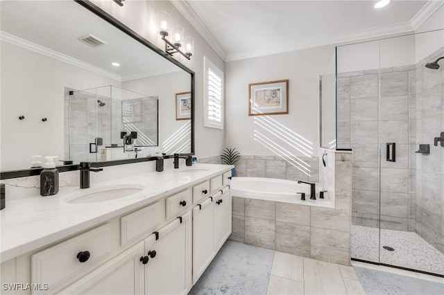 bathroom featuring vanity, crown molding, and separate shower and tub