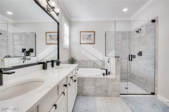 bathroom with crown molding, vanity, and separate shower and tub