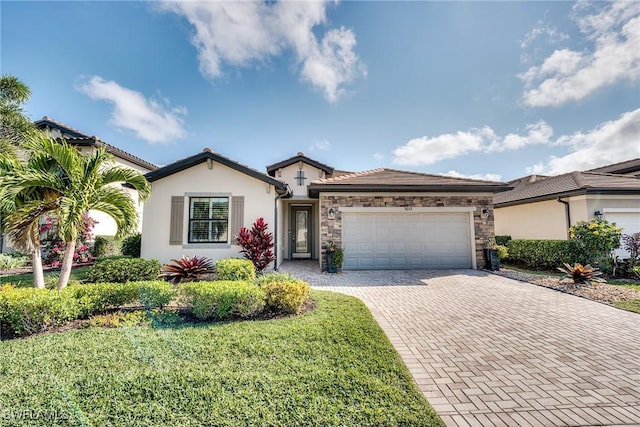 ranch-style home with a garage and a front lawn