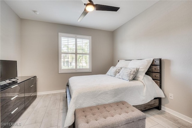 bedroom with light hardwood / wood-style flooring and ceiling fan