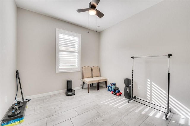 living area with ceiling fan