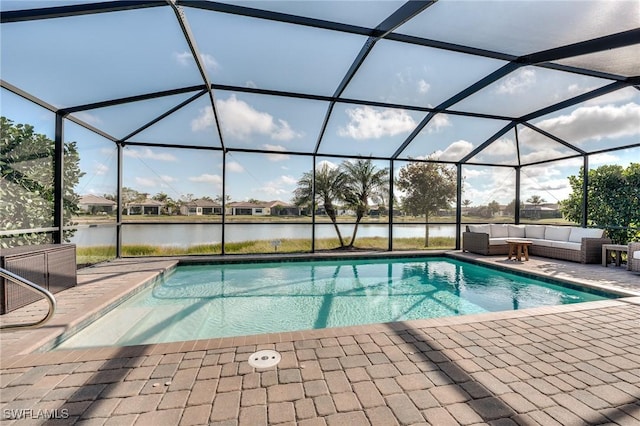 view of swimming pool with an outdoor living space, a water view, glass enclosure, and a patio area