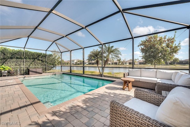 view of pool with a water view, an outdoor hangout area, a patio area, and glass enclosure