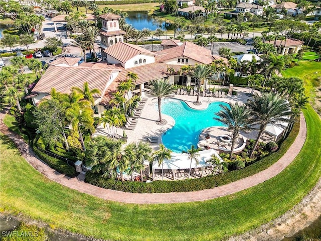 birds eye view of property with a water view