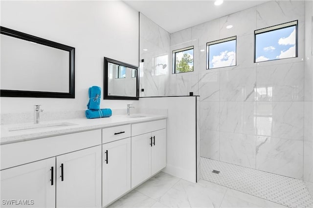 bathroom featuring vanity and a tile shower