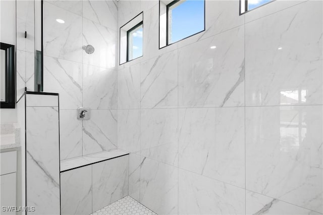 bathroom featuring tiled shower