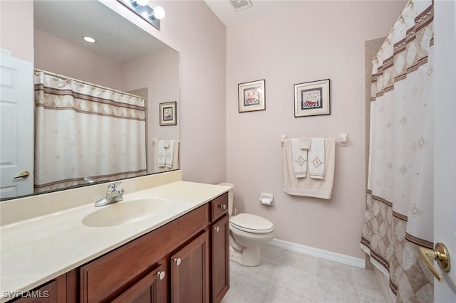 bathroom featuring vanity, toilet, and a shower with shower curtain