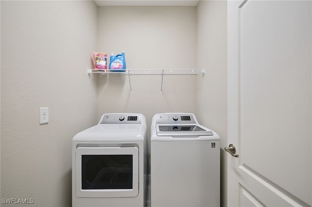 laundry area featuring washer and clothes dryer