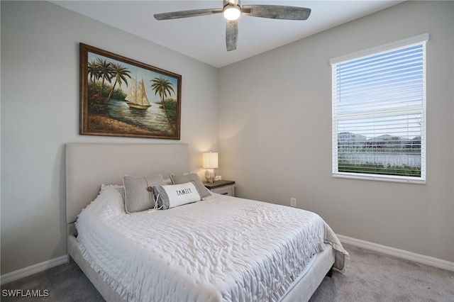 bedroom with ceiling fan and carpet