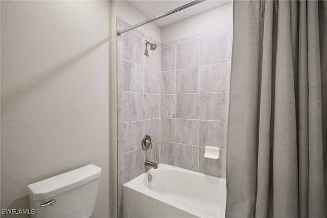 bathroom with shower / tub combo with curtain and toilet