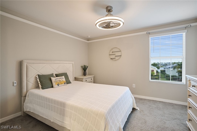 bedroom with ornamental molding and carpet