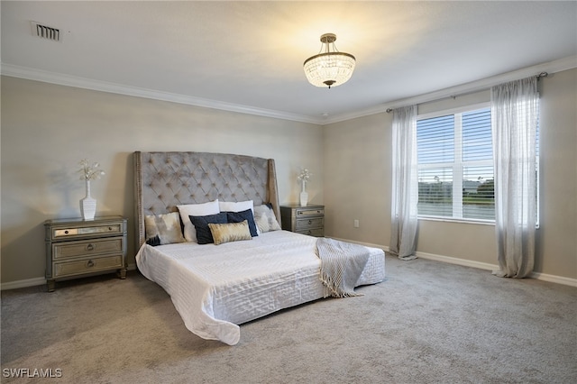 bedroom featuring ornamental molding and light carpet