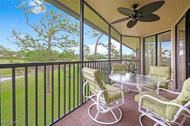 sunroom / solarium with ceiling fan