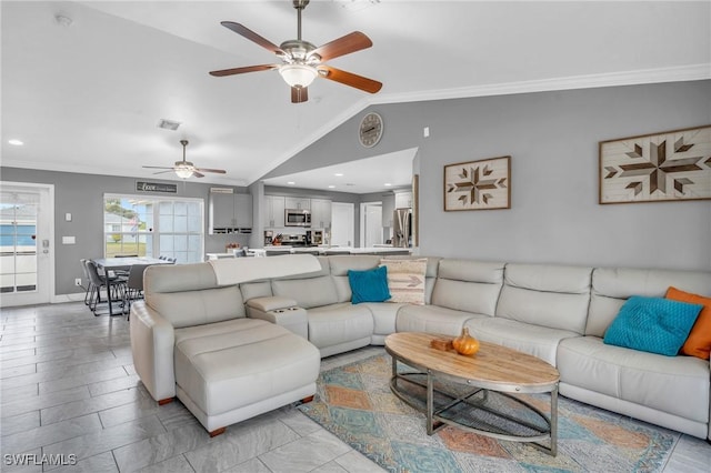 living room featuring vaulted ceiling, ceiling fan, and crown molding