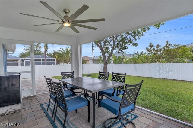 exterior space featuring ceiling fan