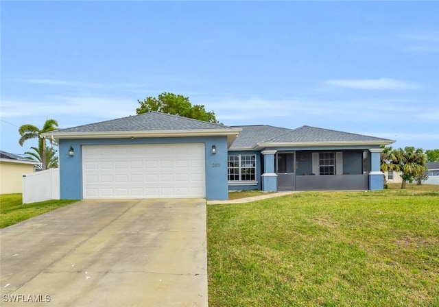 view of front of home featuring a garage and a front lawn