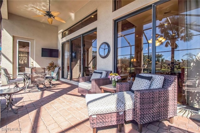 view of patio featuring ceiling fan and an outdoor living space