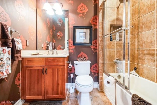 full bathroom with vanity, tile patterned flooring, bath / shower combo with glass door, and toilet