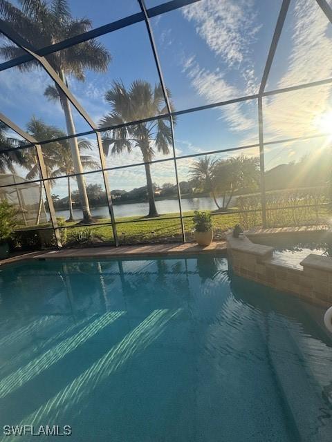 view of swimming pool with glass enclosure