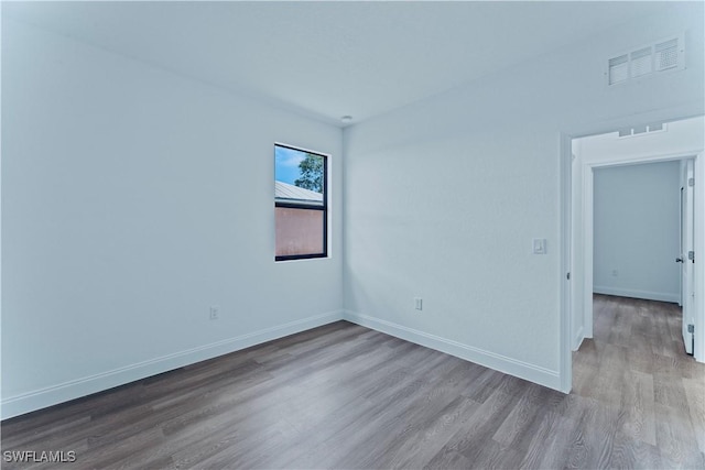 unfurnished room with light hardwood / wood-style floors