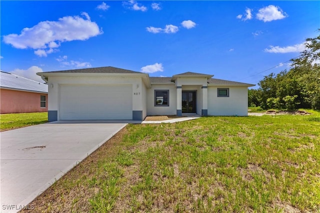 view of front of house with a garage and a front lawn