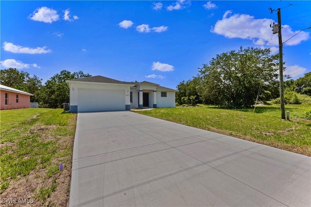 view of front of home featuring a front yard and a garage