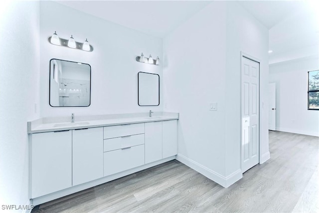 bathroom featuring vanity and hardwood / wood-style flooring