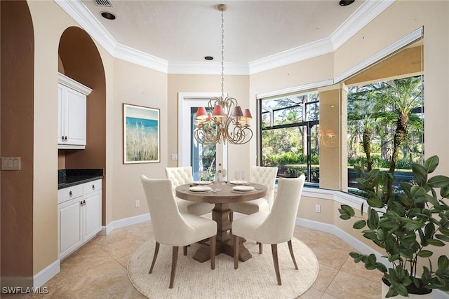 tiled dining area with crown molding and a chandelier