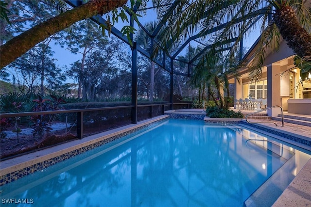 view of swimming pool with an in ground hot tub and a patio