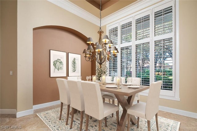 tiled dining room with crown molding and a notable chandelier