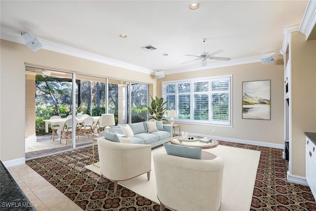 living room with ceiling fan and ornamental molding