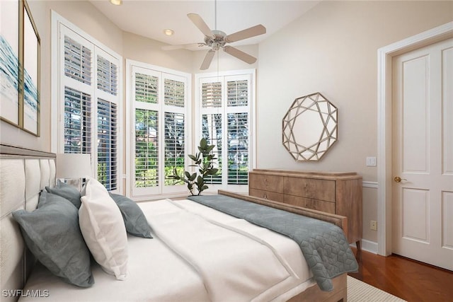 bedroom featuring wood-type flooring and ceiling fan