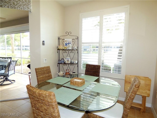 dining space featuring tile patterned floors