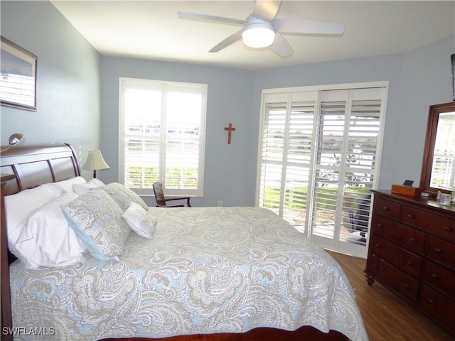 bedroom featuring ceiling fan, access to exterior, and dark hardwood / wood-style flooring