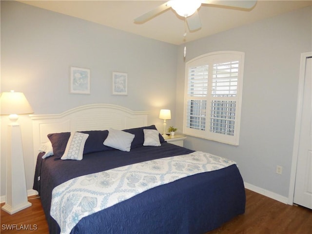 bedroom featuring ceiling fan and dark wood-type flooring