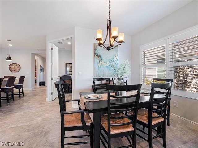 dining room featuring a chandelier